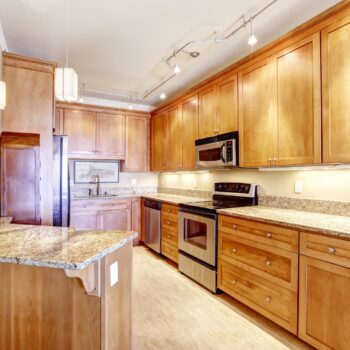 Gilmans Kitchens and Baths Shutter Stocks Light and Brown Kitchen Cabinets