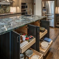 Dark Kitchen Cabinets and Green Tone Granite Kitchen Island